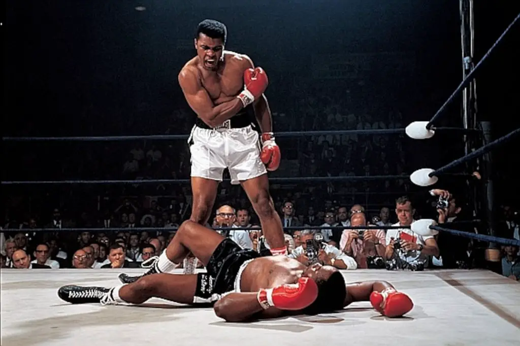 Muhammad Ali standing above his opponent