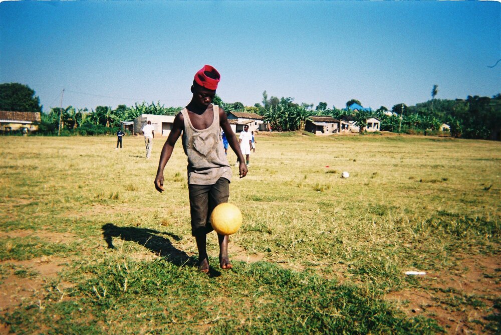 Sport used for education - Child in Rwanda playing football